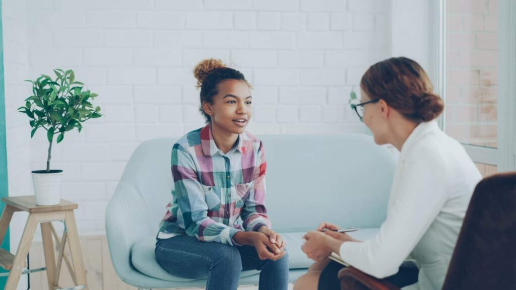 Two women during a Ketamine Injection Therapy in Bloomington, Minnesota session at a Psychiatric Pathways clinic.