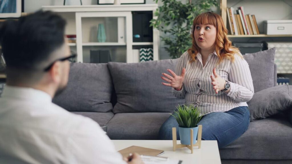 A healthcare professional offering compassionate support to a woman during a consultation with a ketamine treatment for OCD specialist in Bloomington, Minnesota.